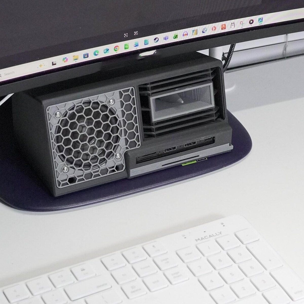 Six-In-One Under-Monitor Desktop Multi-Function Dock, Integrated Audio Speaker, NVMe Storage Bay And Multi-Port Media Hub